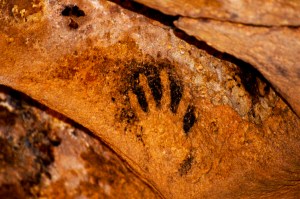 a handprint on a cave